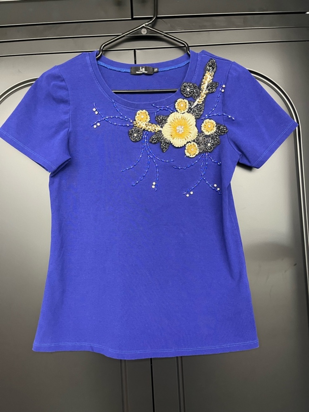 Royal Blue Short-Sleeve Tee with Yellow Floral Appliqué runs small